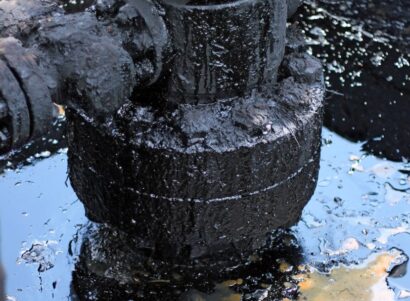 Image of oil well and water pollution