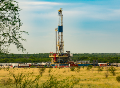 Fracking shale well in a grassy field during the day